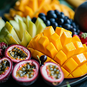 Lush tropical fruit platter close up, with a focus on the vibran